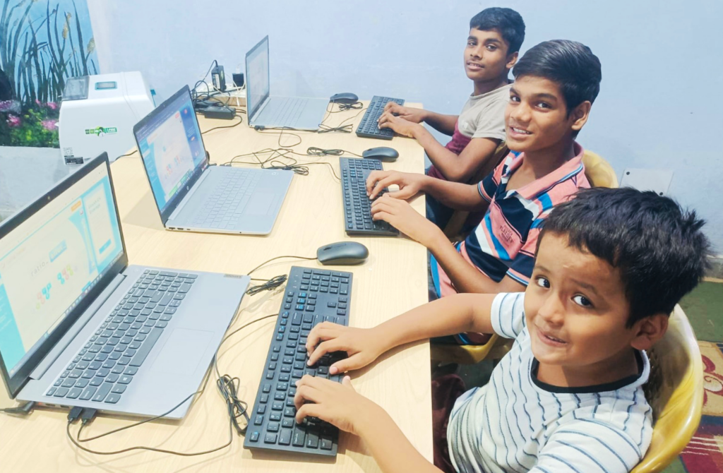 House of Peace children learning about computers