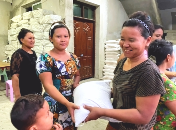 poor woman receiving food rations