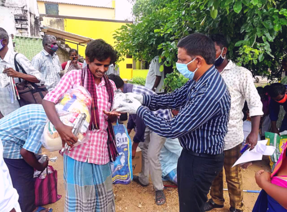 blind man receiving food package