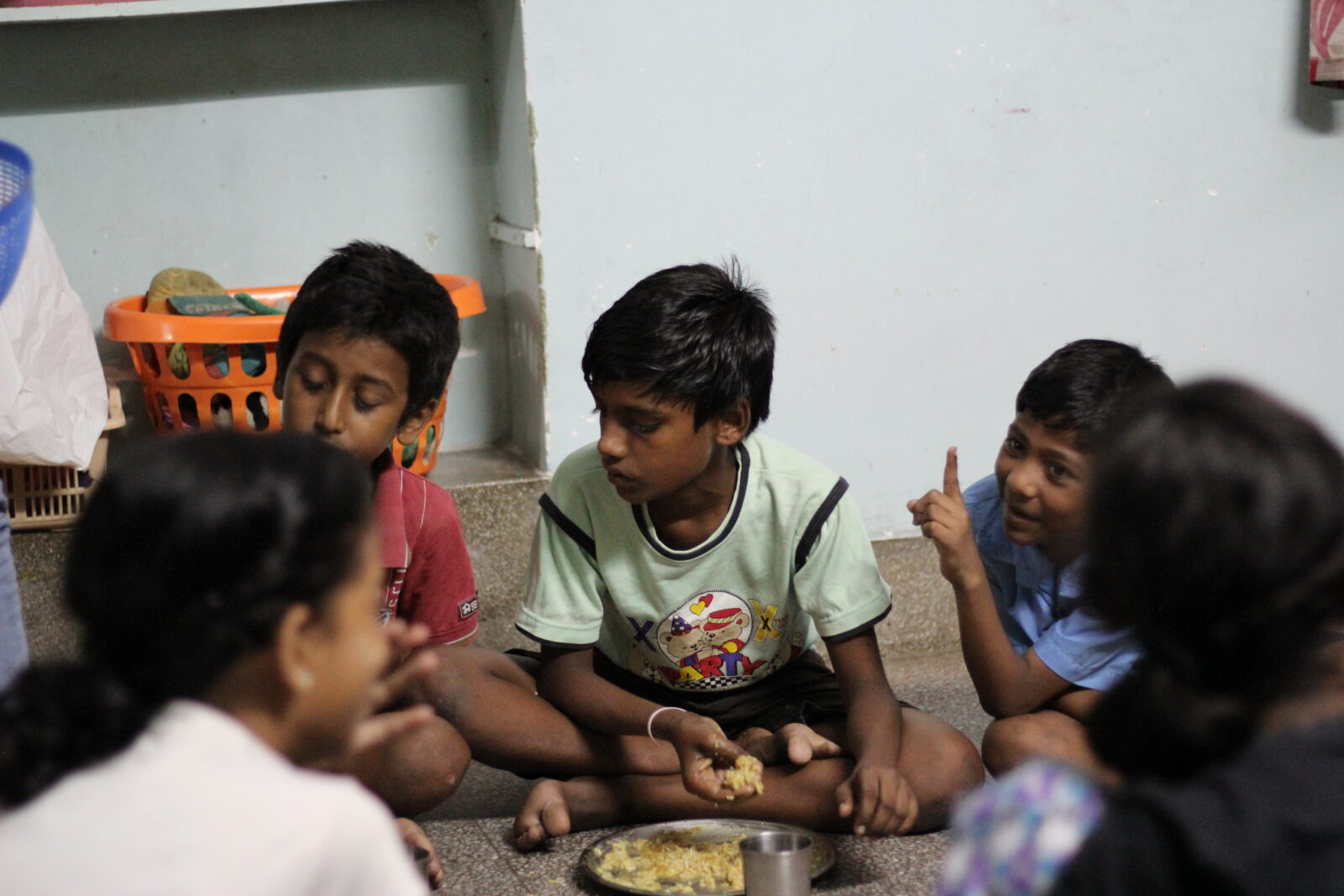 children eating at day center calcutta