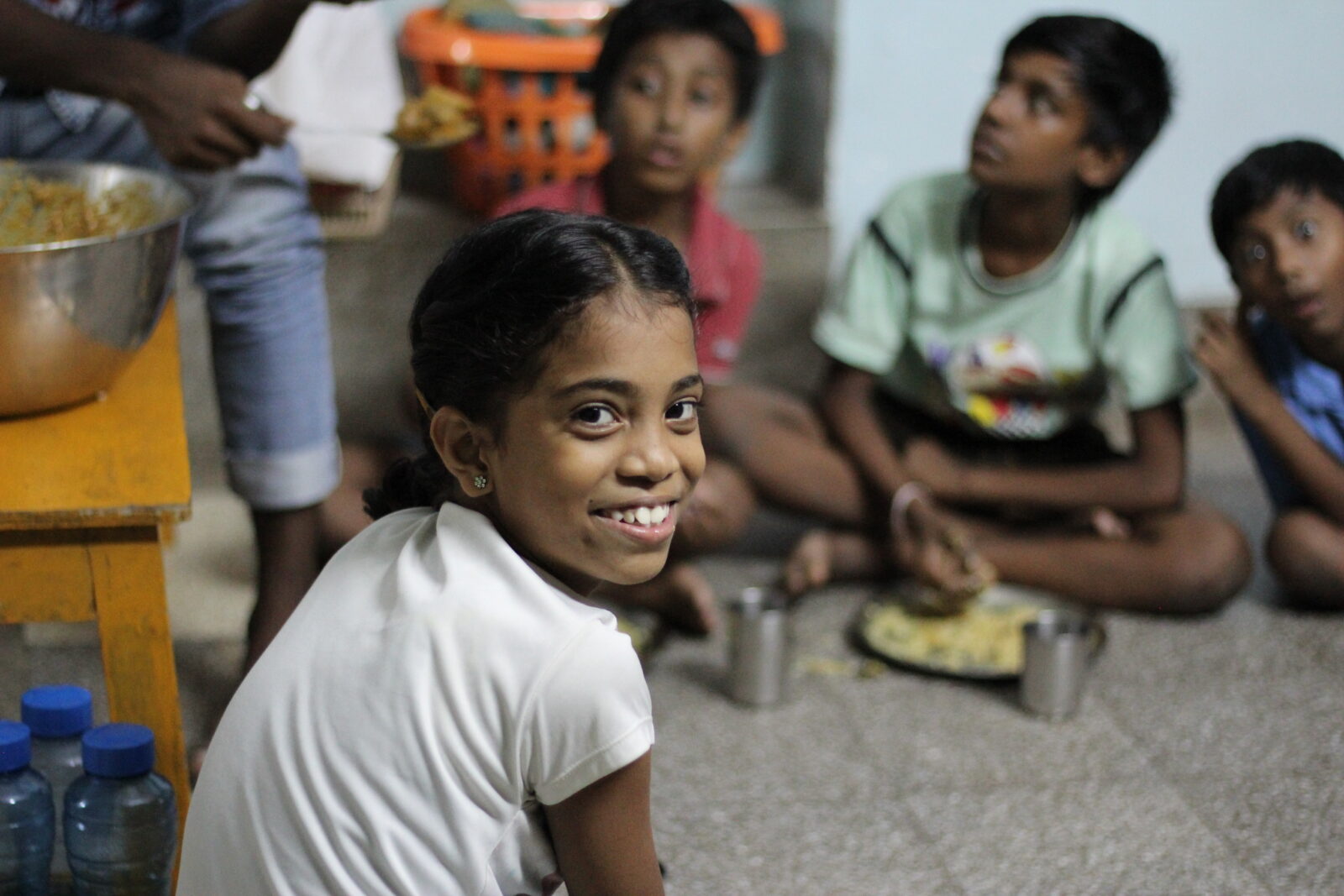 girl at day center smiling