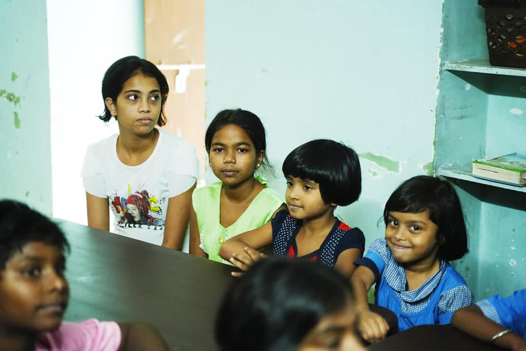 group of street girls sitting at table