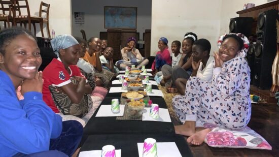 Girls at Fountain of Hope having supper