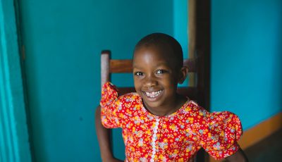 Uganda child smiling at the camera