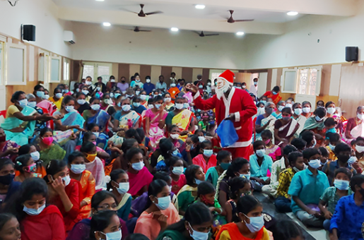 santa handing out gifts in India
